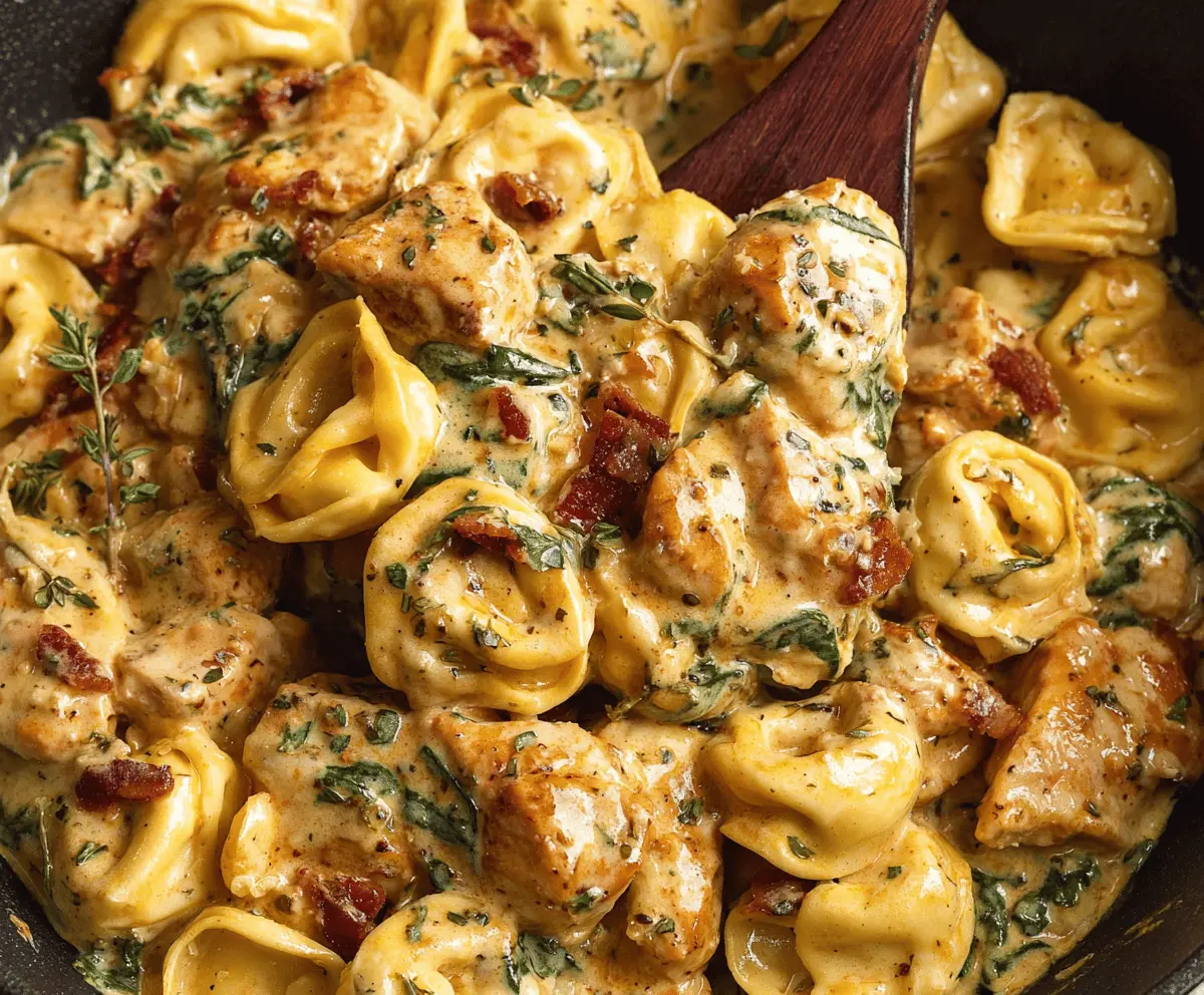 Creamy Marry Me Chicken Tortellini dish with tender tortellini, fresh herbs, and melted cheese in a rich sauce, perfect for a romantic dinner.
