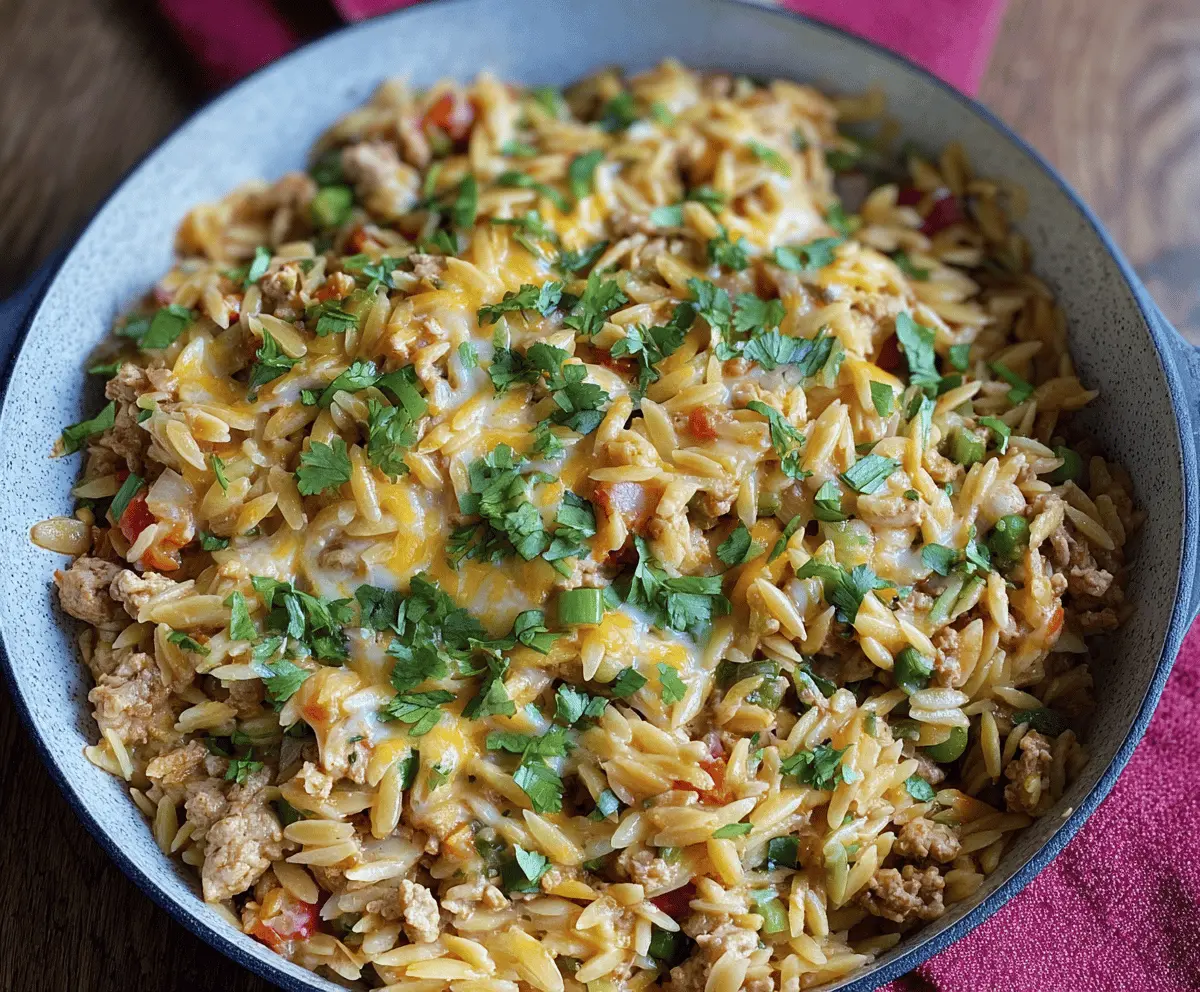 Delicious ground turkey orzo pasta dish topped with fresh herbs, perfect for a healthy and easy meal