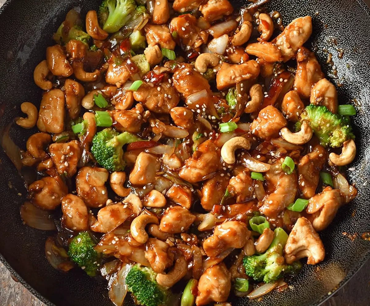 Delicious Easy Authentic Cashew Chicken served on a plate with fresh vegetables.