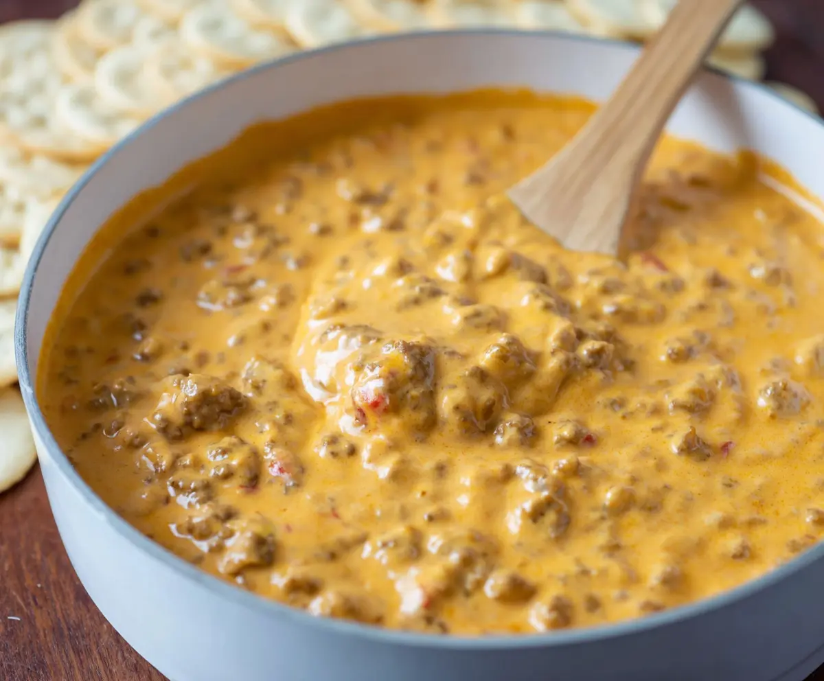 Delicious easy rotel dip with sausage served in a bowl, perfect for parties and snack time