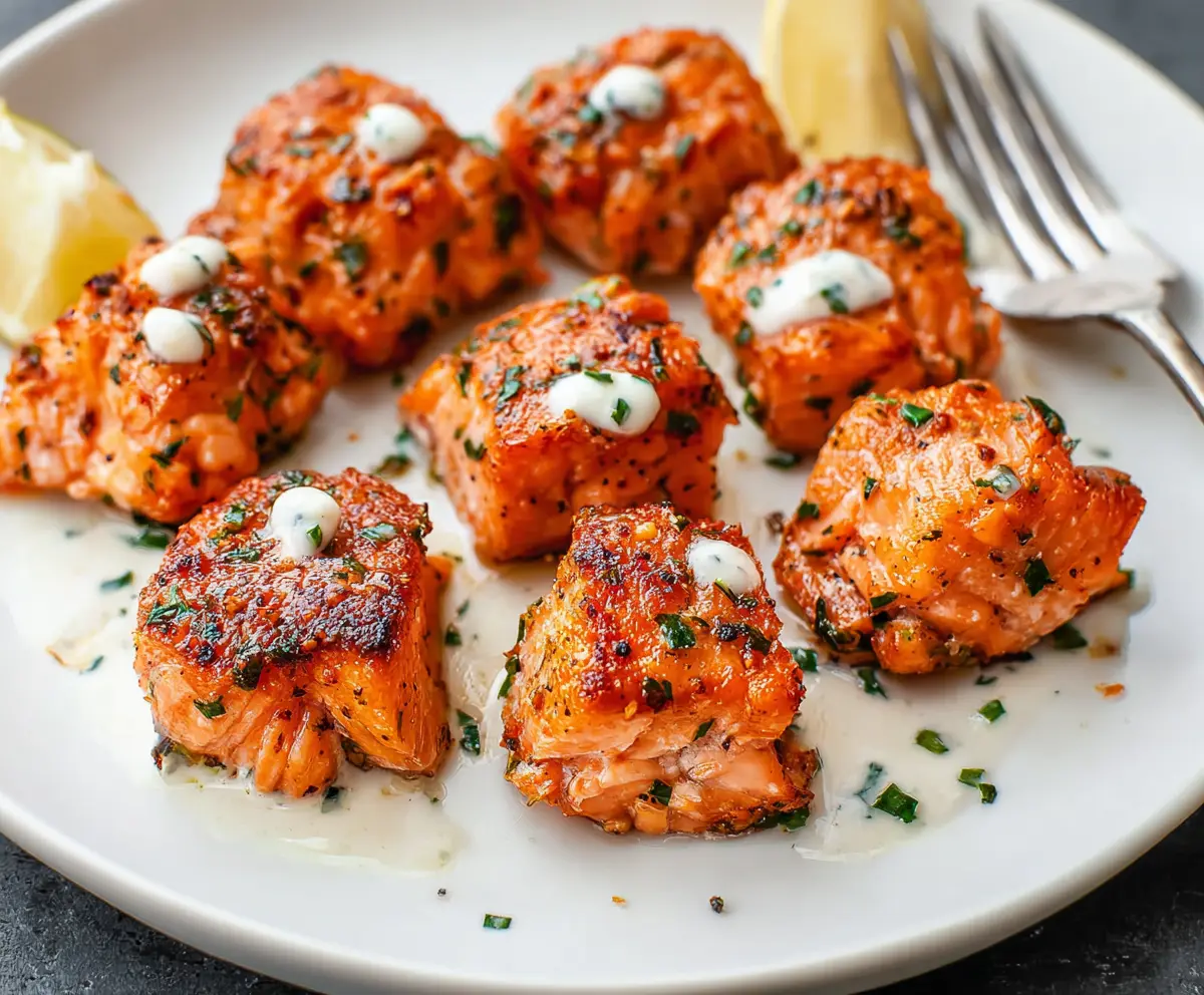 Delicious salmon bites served on a plate, showcasing a flavorful seafood appetizer perfect for quick meals.